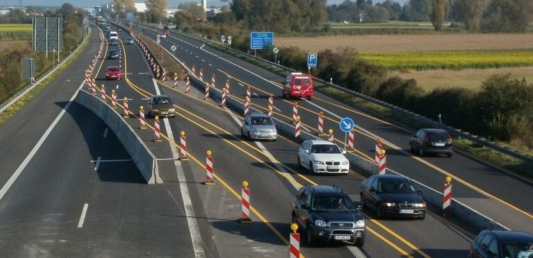 Traffic through construction zone with lane markers splitting